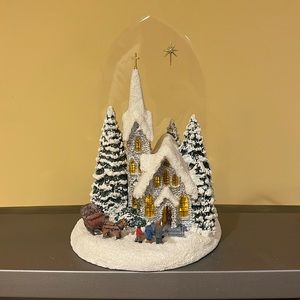 Thomas Kinkade, painter of lights, Winter at Mountain Chapel.